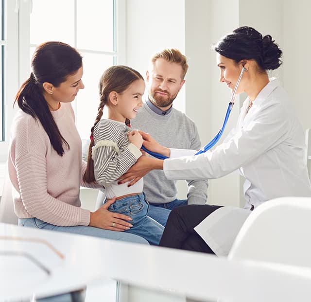 Happy family on a visit with the doctor