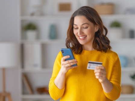 Woman using her phone for a checkout